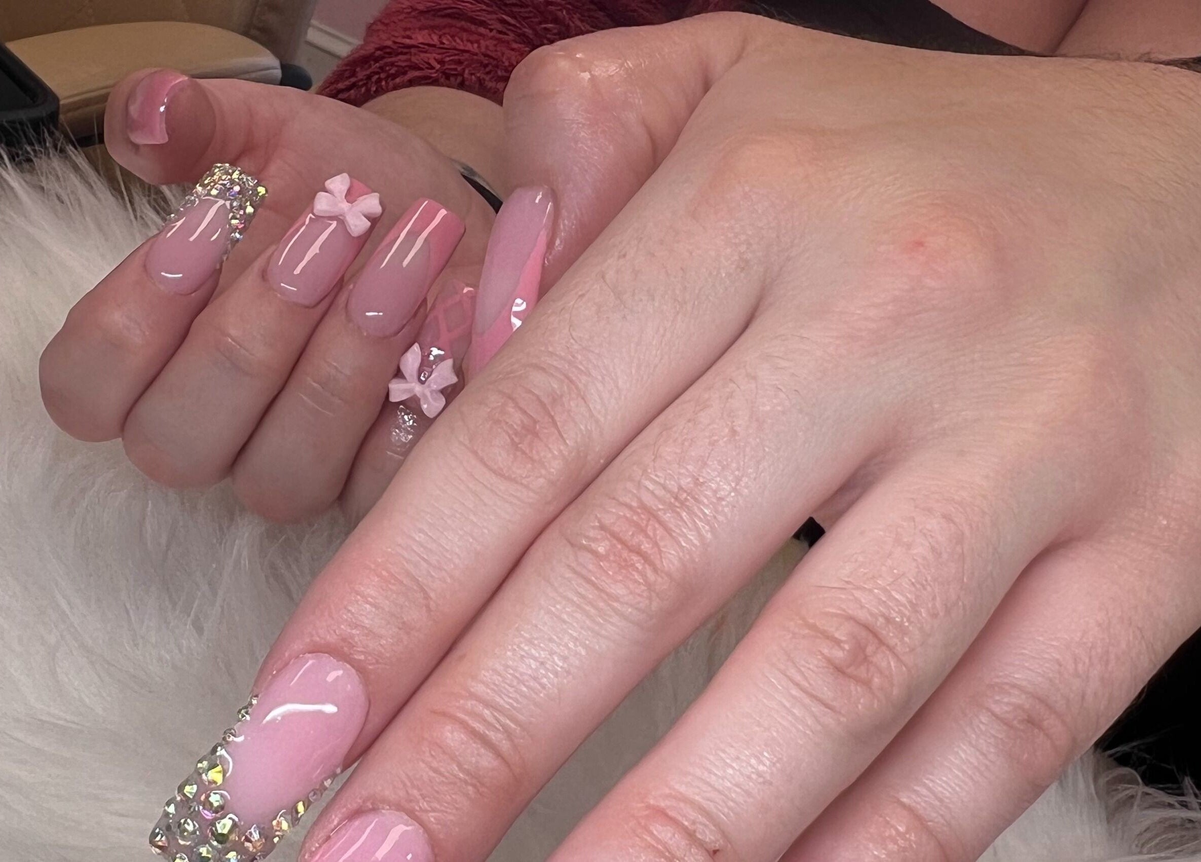 Elegant pink and rhinestone nail art at Diva Nails, Methuen, Massachusetts, US.