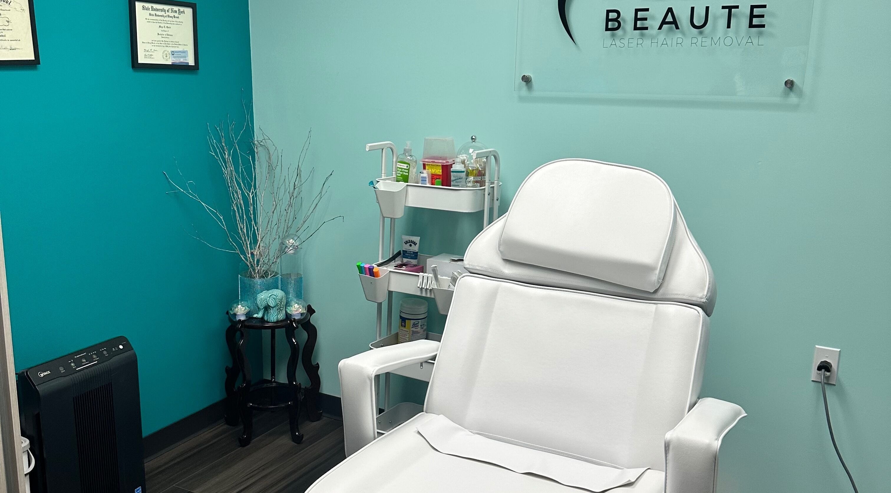 Relaxing treatment room at 5AM Beaute Laser Hair Removal, Garden City, New York, US features plush chair and decor.
