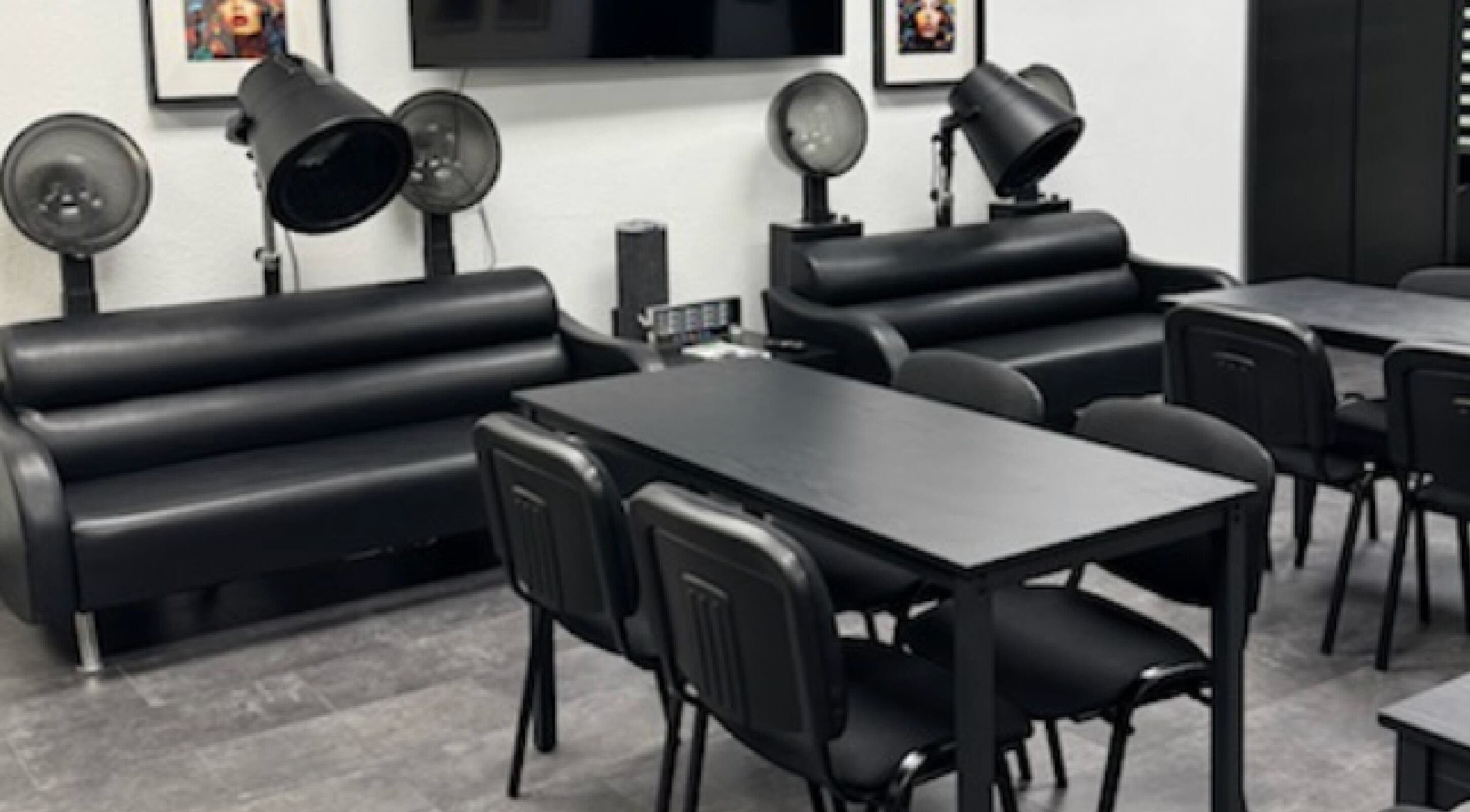 Modern salon seating with dryers at Fluent Strands, San Antonio, Texas, US.