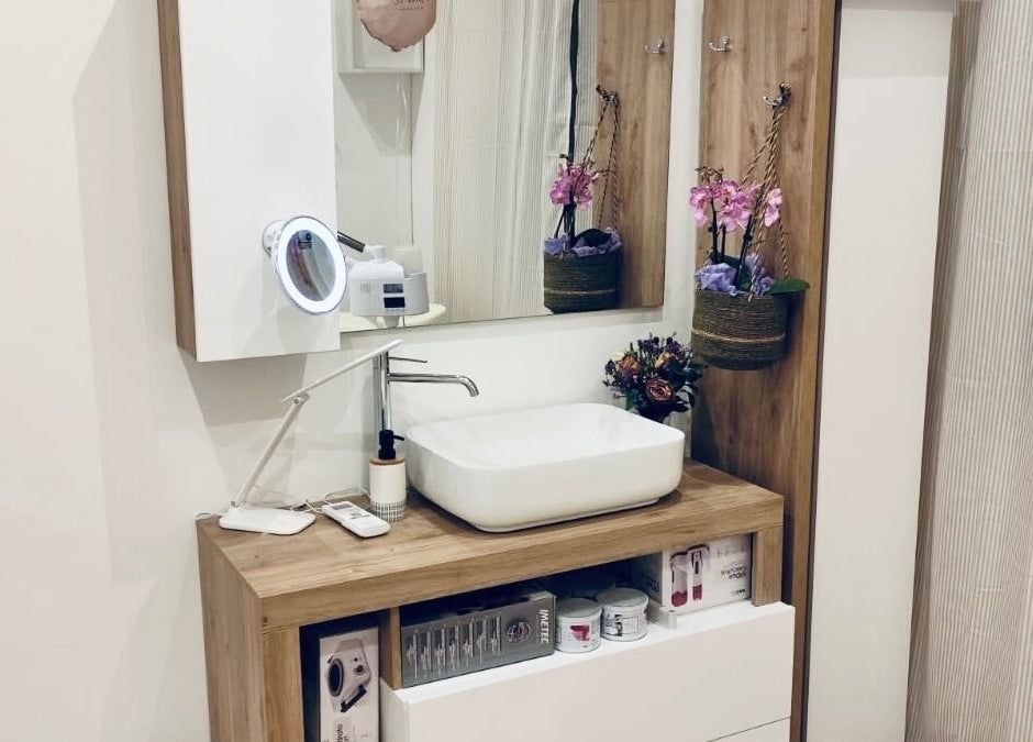 Stylish vanity area at Nail It in Bologna, Emilia-romagna, IT, featuring modern sink and decor.