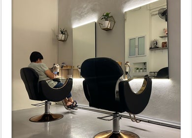 Modern salon interior at Hair Lover Salon, Klang, Selangor, MY with stylish chairs and illuminated mirrors.