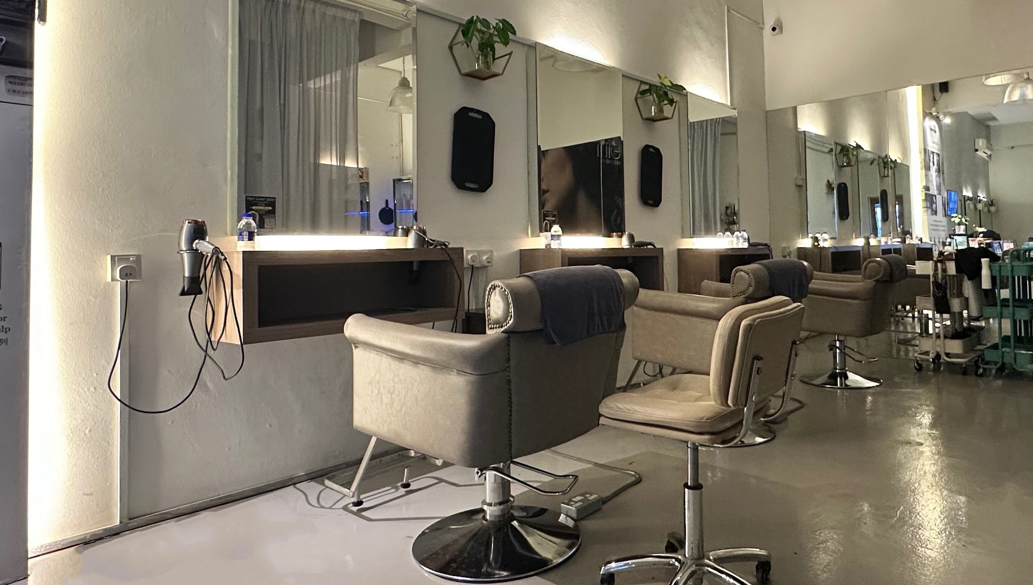 Modern salon stations at Hair Lover Salon, Klang, Selangor, MY, with sleek chairs and mirrors.