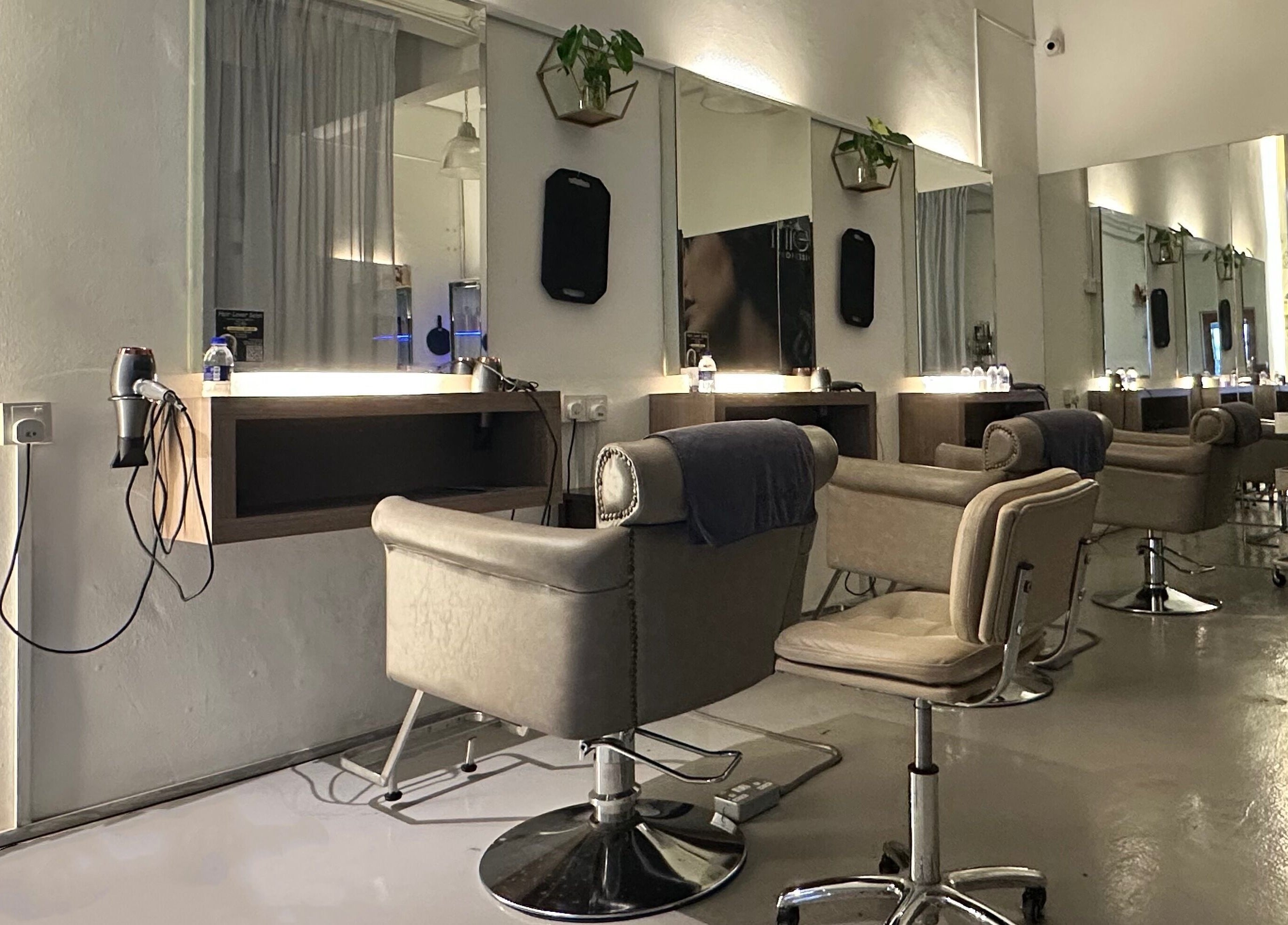 Modern salon stations at Hair Lover Salon, Klang, Selangor, MY, with sleek chairs and mirrors.