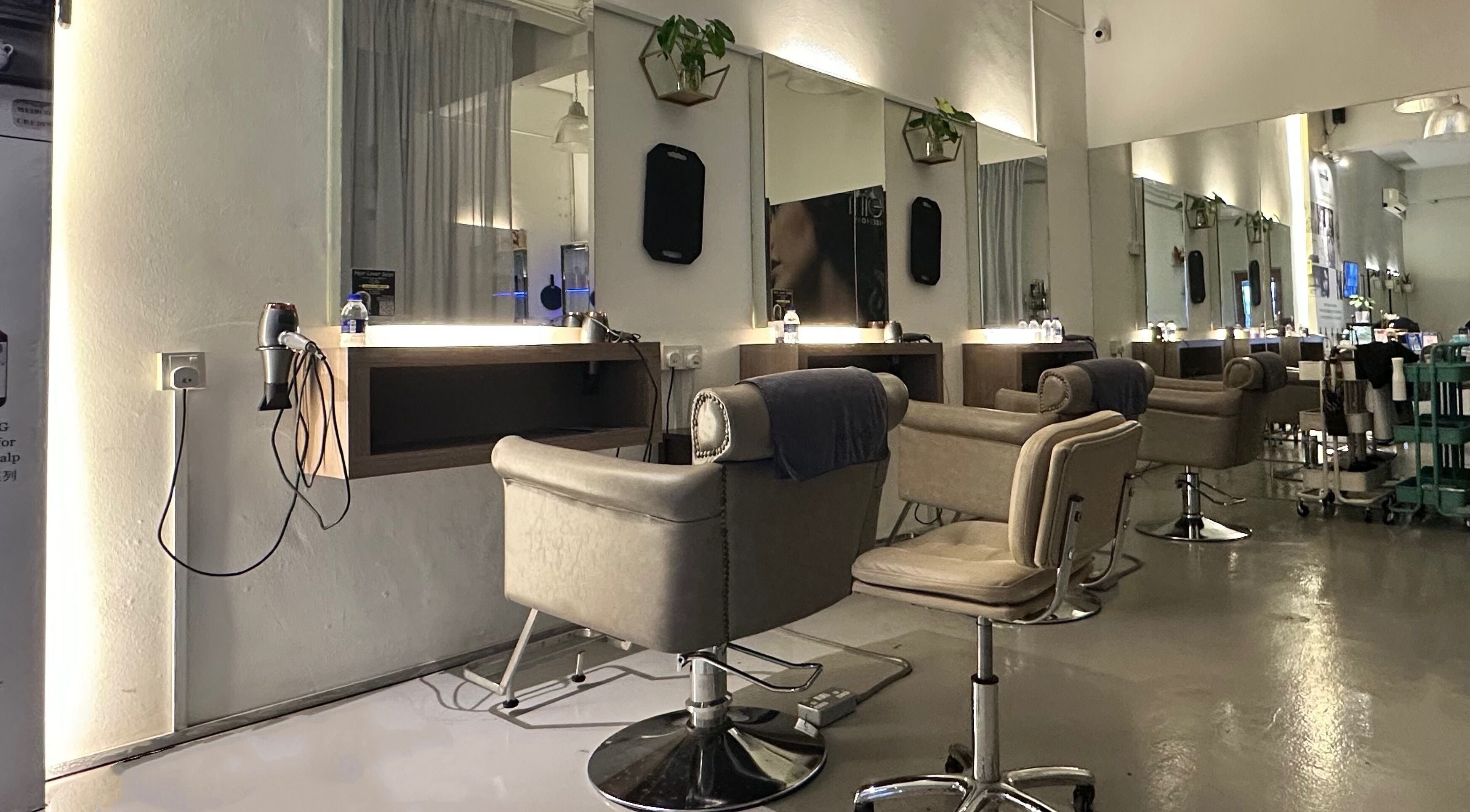 Modern salon stations at Hair Lover Salon, Klang, Selangor, MY, with sleek chairs and mirrors.