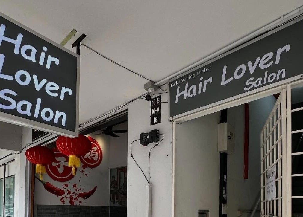 Entrance signage of Hair Lover Salon in Klang, Selangor, MY, showcasing modern decor.