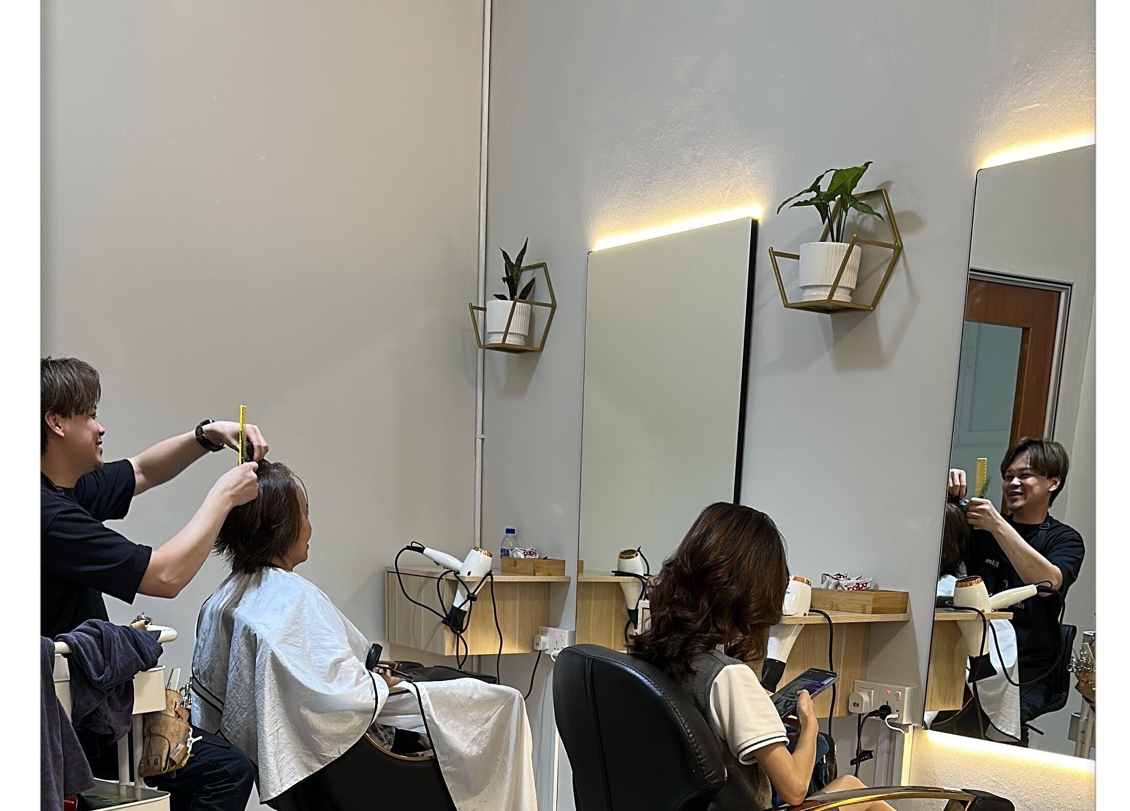 Customer receiving a haircut at Hair Lover Salon, Klang, Selangor, MY.