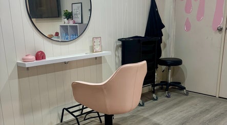 Elegant styling chair in Pink Honey Hair Studio, Lake Macdonald, Queensland, AU, with a modern decor aesthetic.