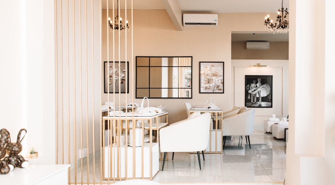 Chic interior of POSH Nail Salon in Cape Town, Western Cape, ZA with modern decor and plush seating.