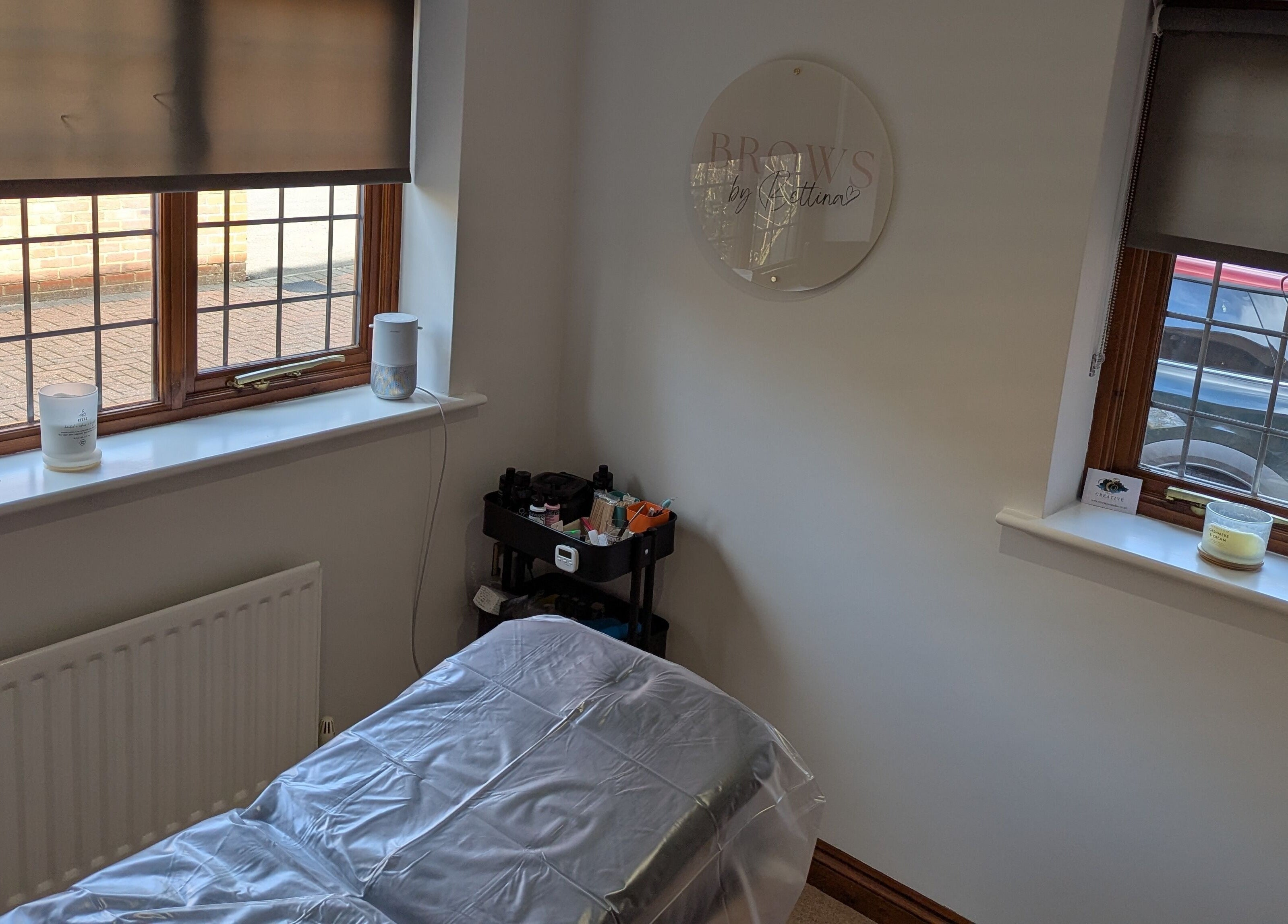 Tranquil treatment room at Brows by Bettina, Tadley, England, GB with natural light and comfortable setup.
