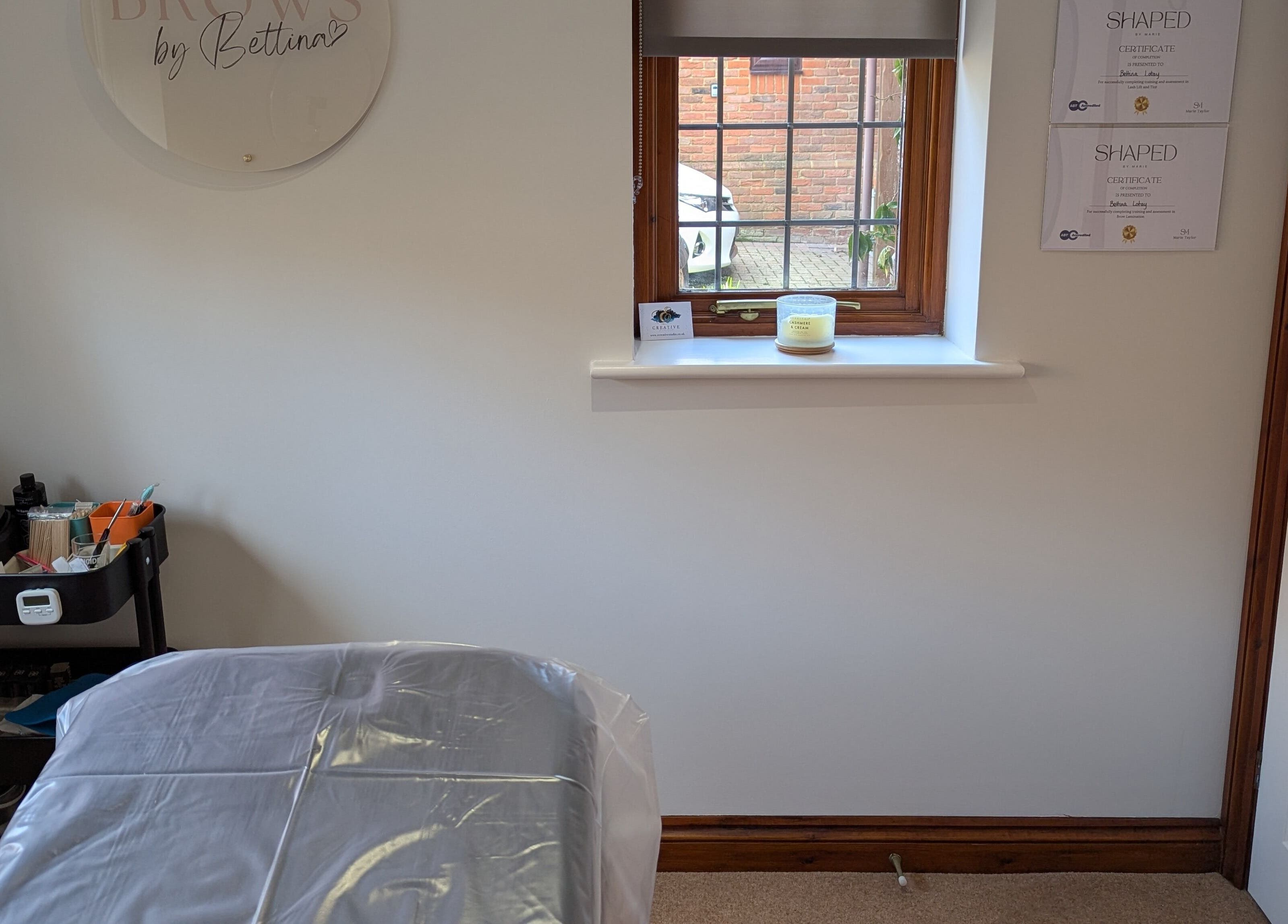 Brows by Bettina studio in Tadley, England, showcasing a tranquil treatment room with clean design.