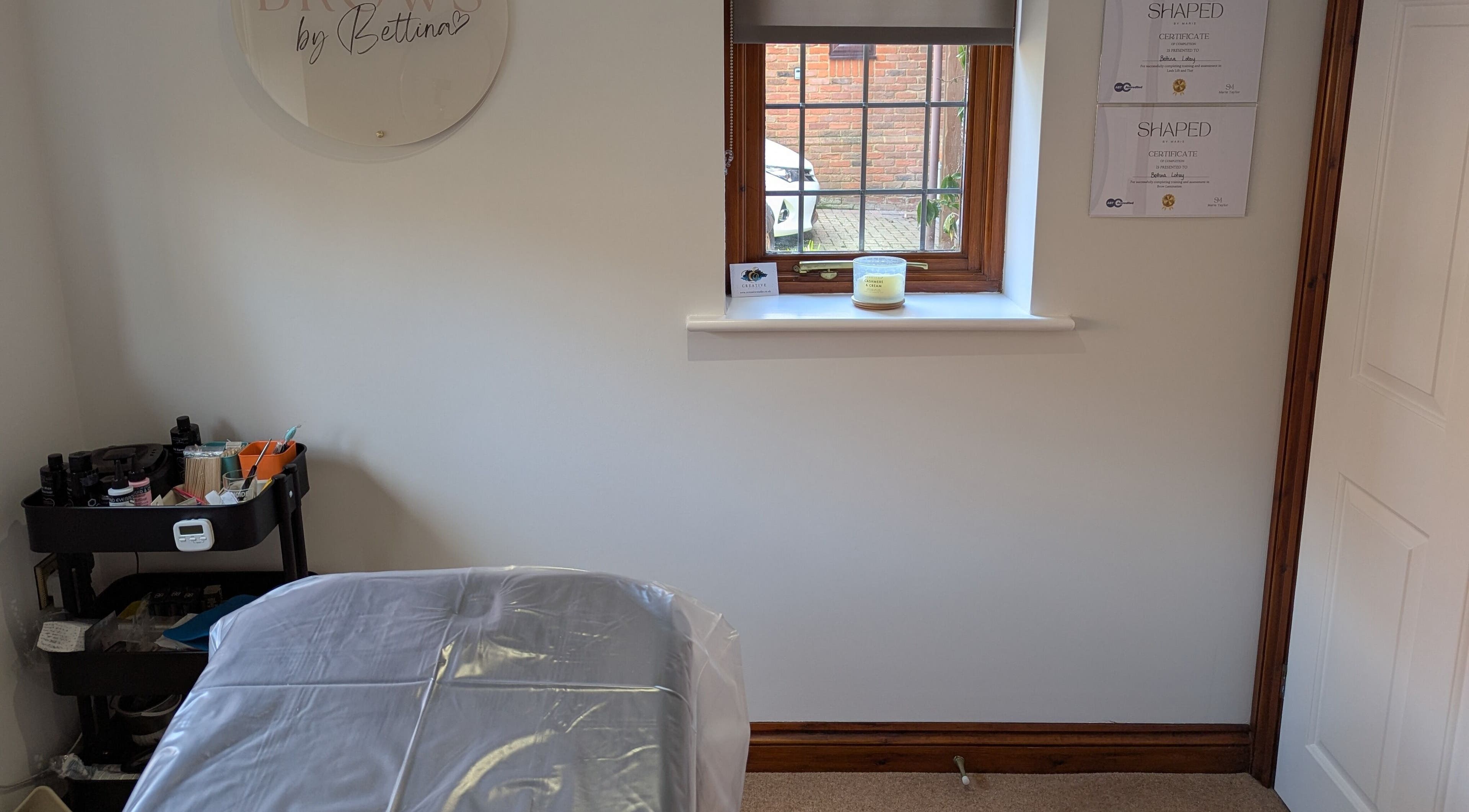 Brows by Bettina studio in Tadley, England, showcasing a tranquil treatment room with clean design.