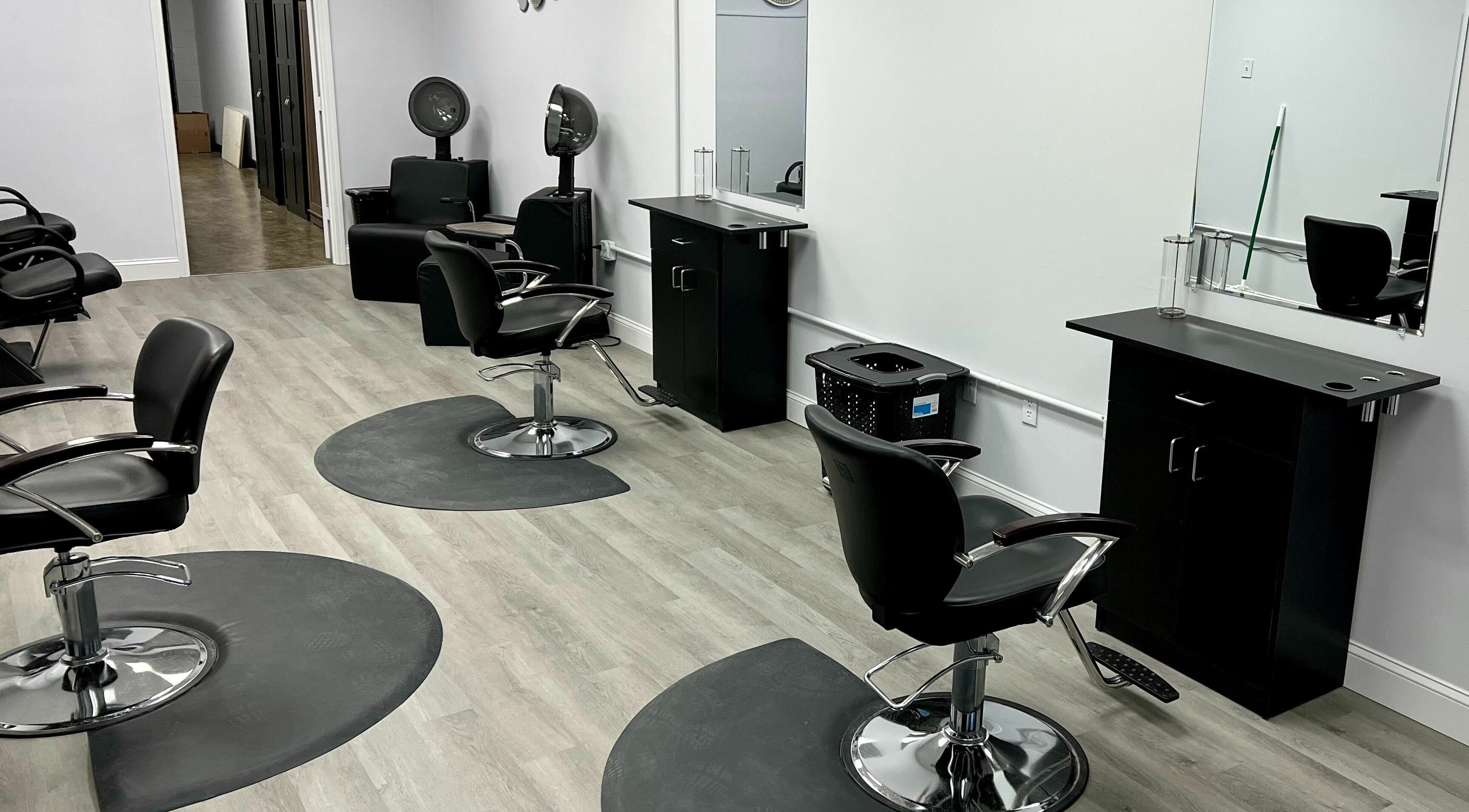 Modern styling chairs and mirrors at Platinum Salon, Salem, Virginia, US offer a sleek salon experience.