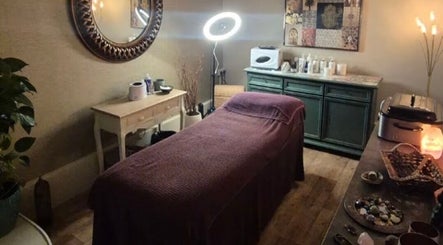 Relaxing massage room at Zen Den Beauty and Wellbeing Centre, Humberston, GB. Cozy decor with ambient lighting.