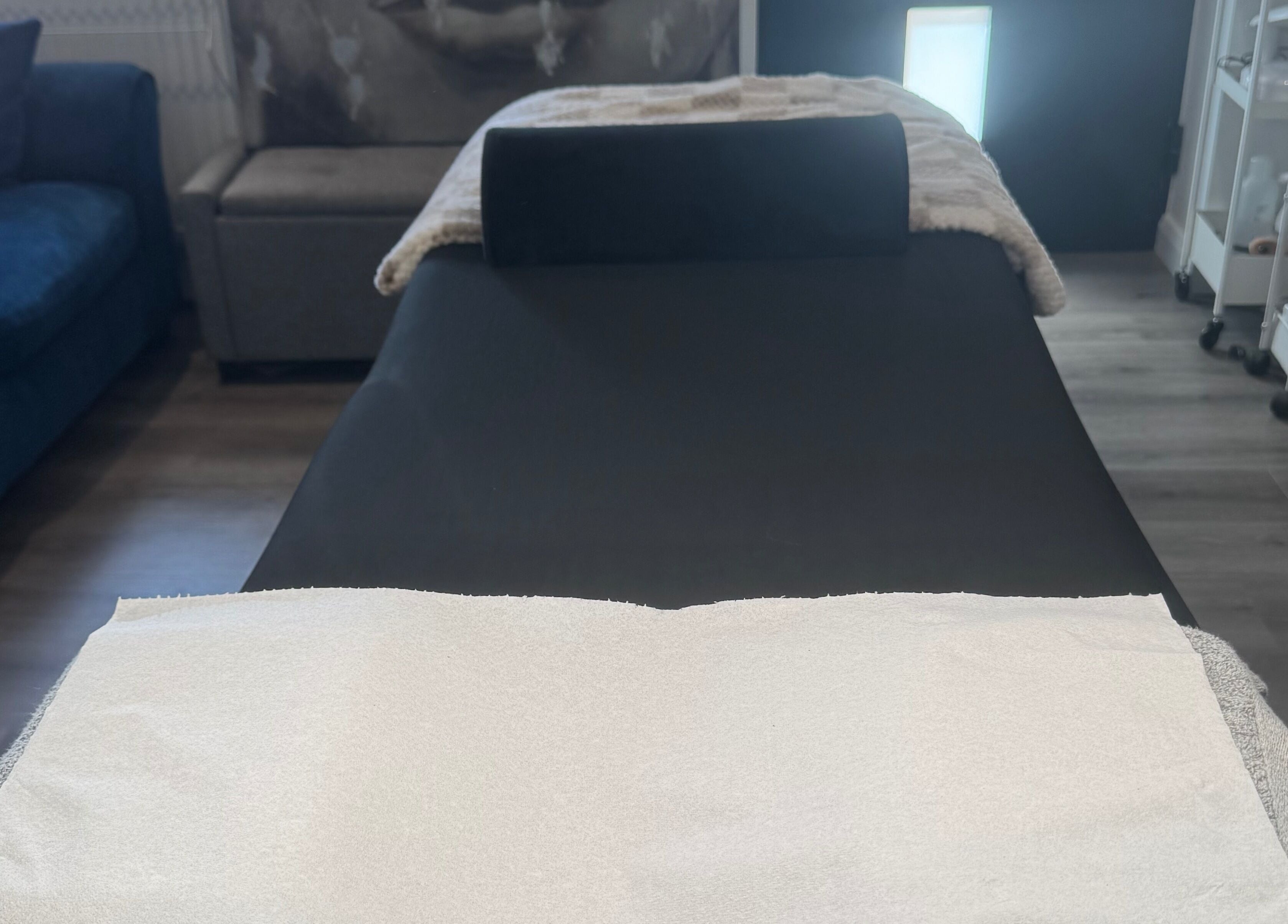 Treatment room at Glambylilymay in Hadleigh, England, GB with a cozy massage bed and serene ambiance.