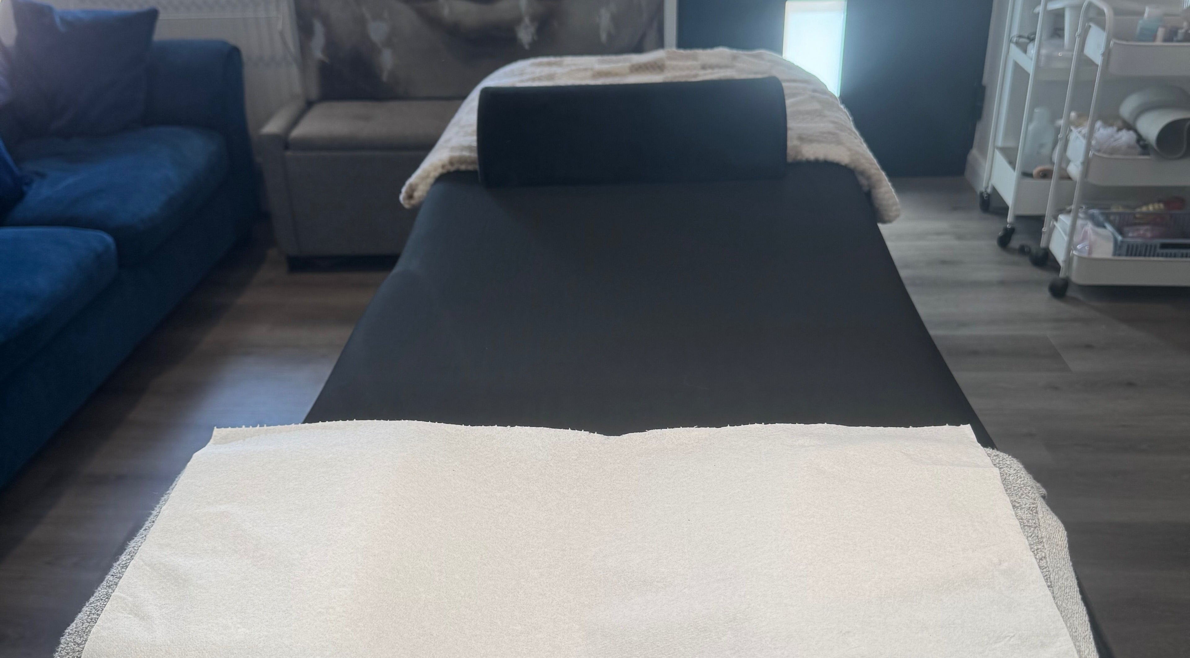 Treatment room at Glambylilymay in Hadleigh, England, GB with a cozy massage bed and serene ambiance.