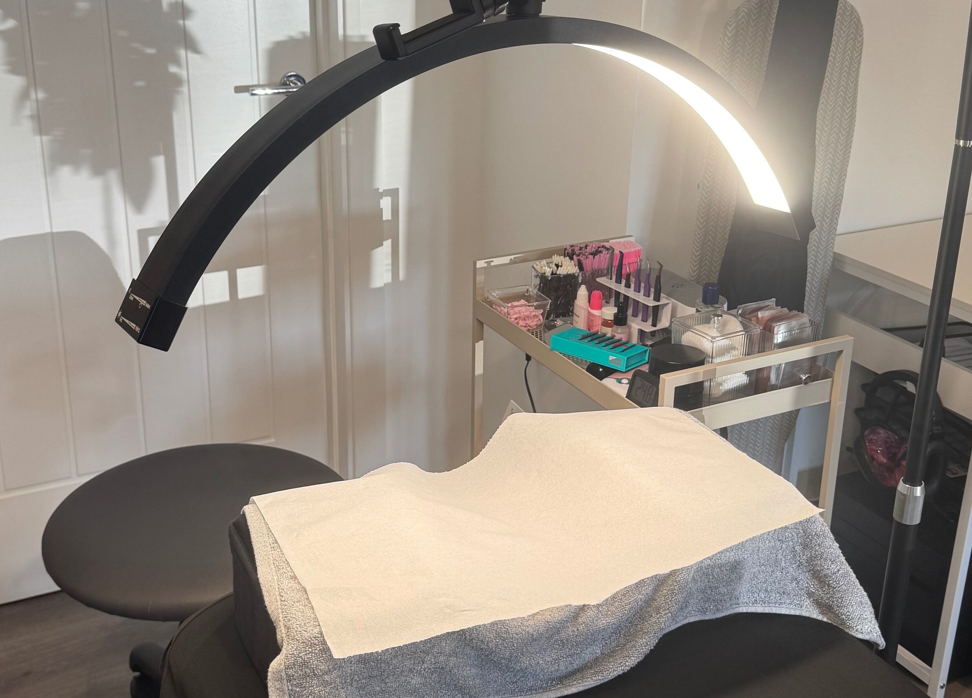 Glambylilymay's tranquil treatment area in Hadleigh, England, GB, with modern lighting and organized beauty tools.