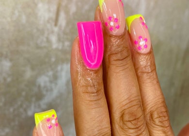 Vibrant neon pink and yellow floral nails at Iconic Nail Bar, Johannesburg South, Gauteng, ZA.
