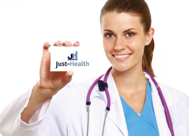Smiling doctor at Just Health Harrow Driver Medical Clinic HA3 7BB, London, England, GB holds clinic card.