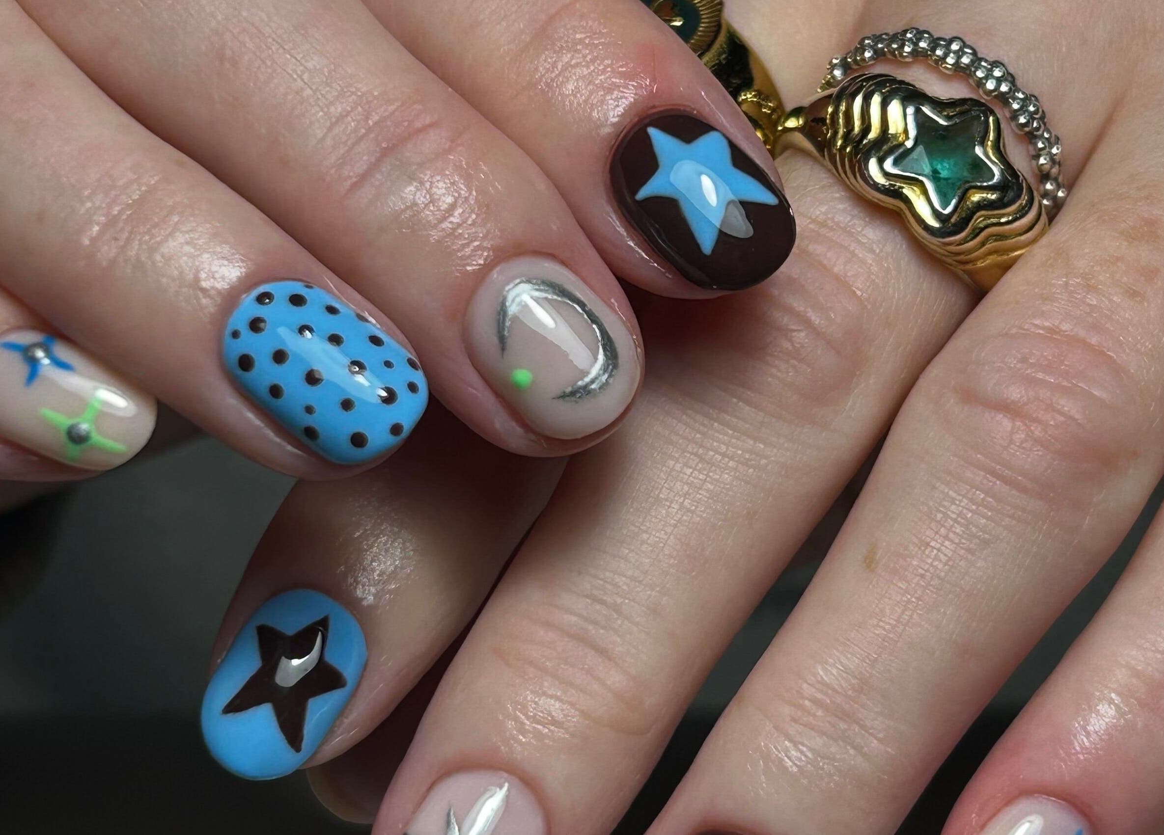 Intricate star and dot nail art by nailsbyaoifemc in Derry, Northern Ireland, GB. Stylish and unique designs.