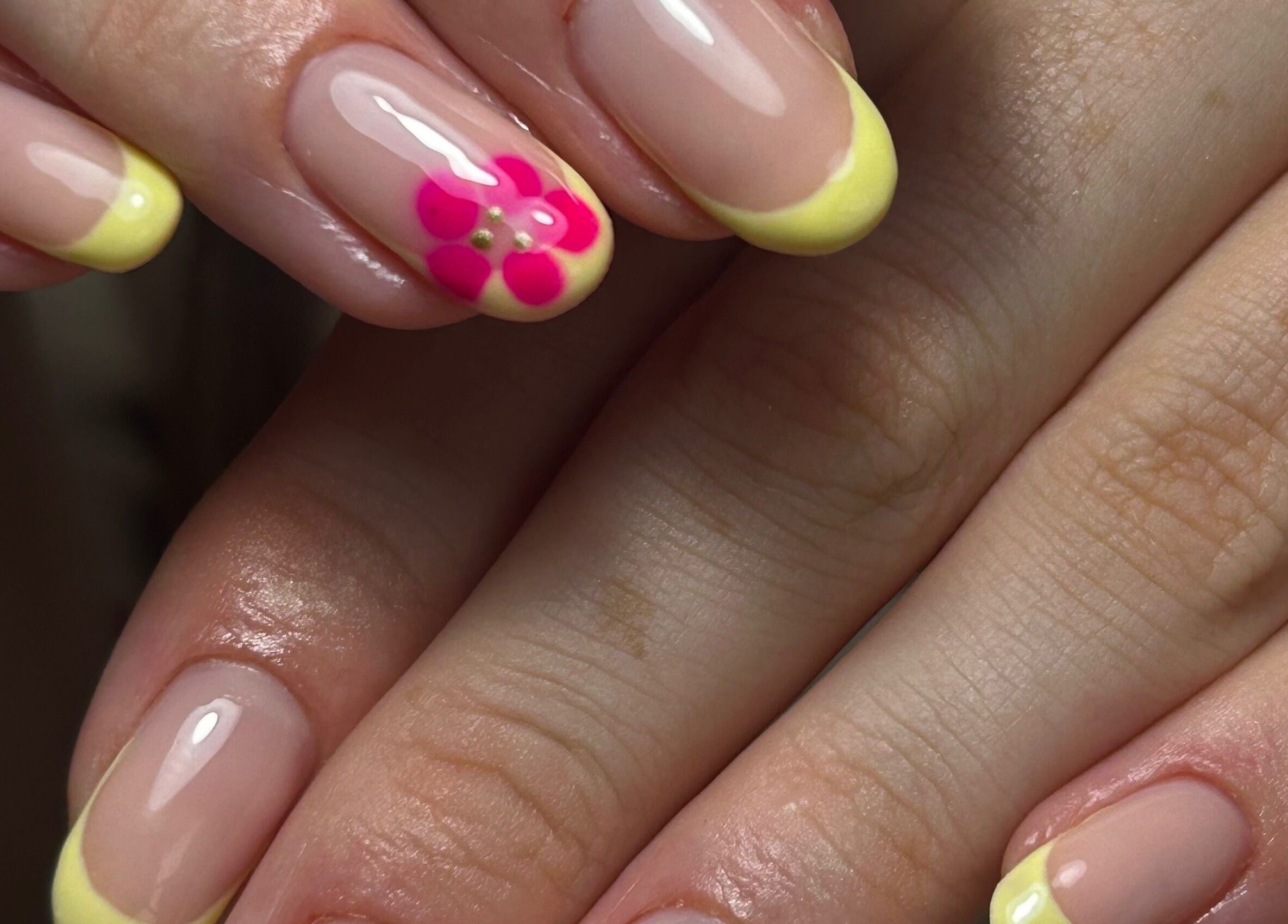 Bright floral nail art with yellow tips at nailsbyaoifemc, Derry, Northern Ireland, GB.