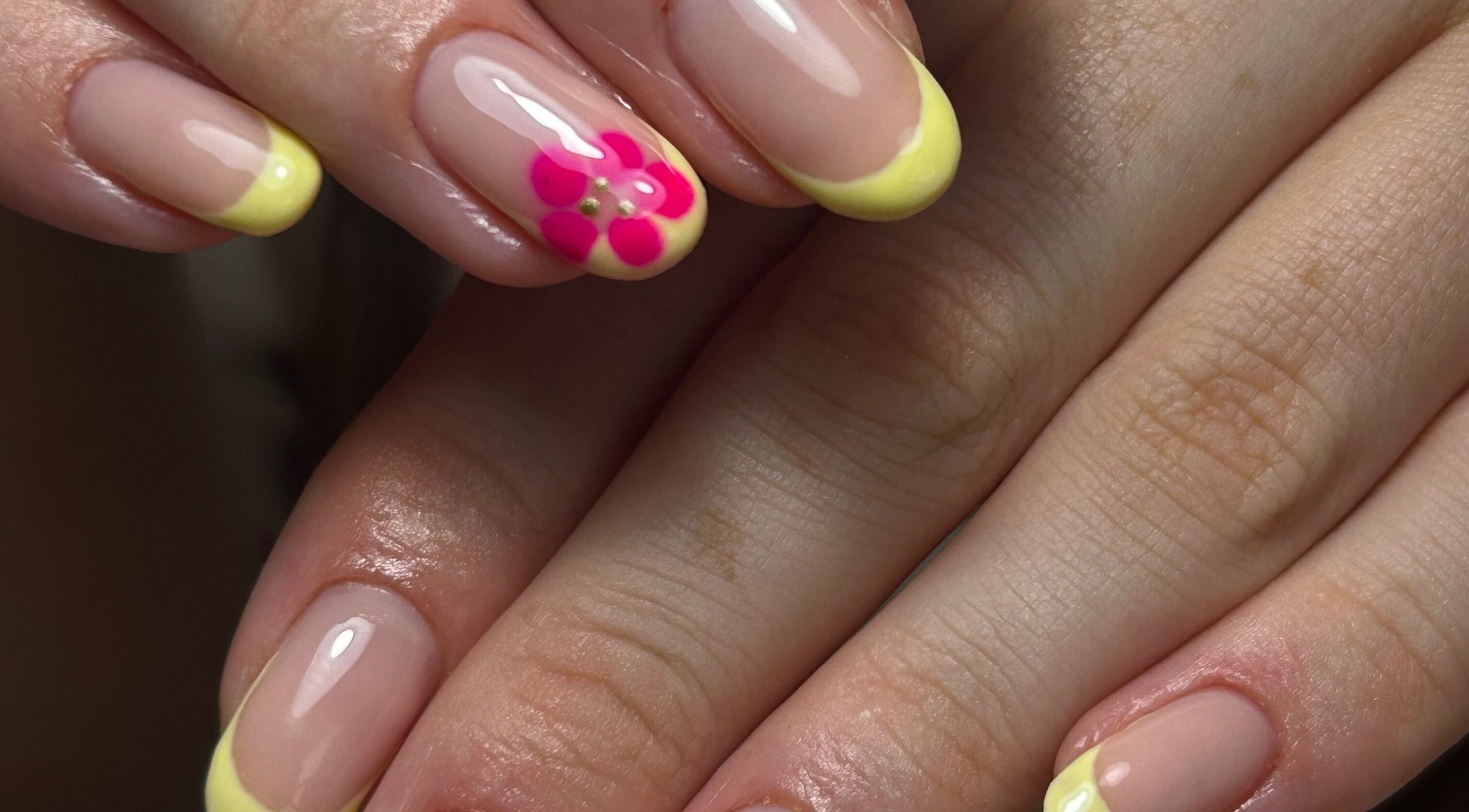 Bright floral nail art with yellow tips at nailsbyaoifemc, Derry, Northern Ireland, GB.