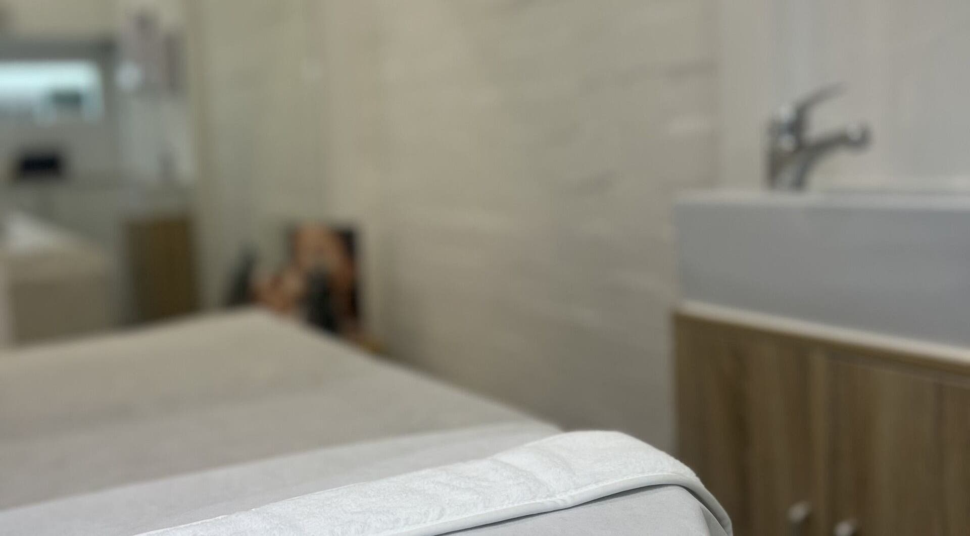 Relaxing treatment room at JC Skin Therapy, Melbourne, Victoria, AU, featuring a plush treatment bed.