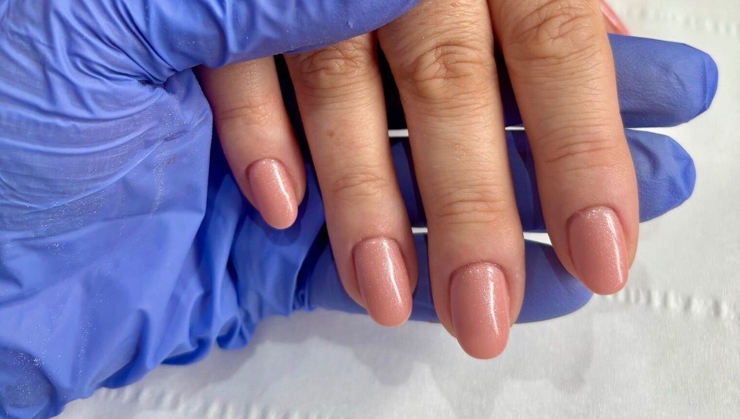 Gorgeous manicured nails at Younger Beauty, Preston, England, GB with a shimmering nude polish.