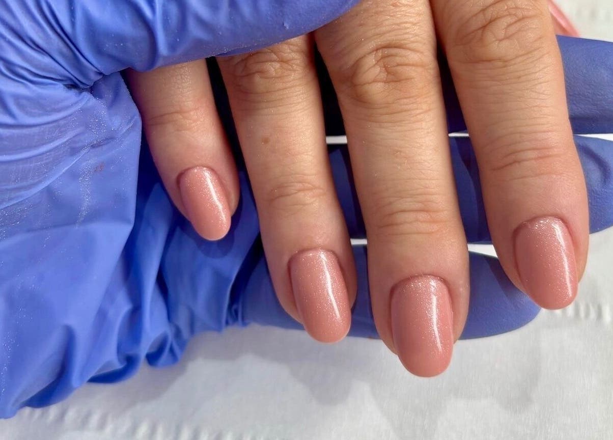 Gorgeous manicured nails at Younger Beauty, Preston, England, GB with a shimmering nude polish.