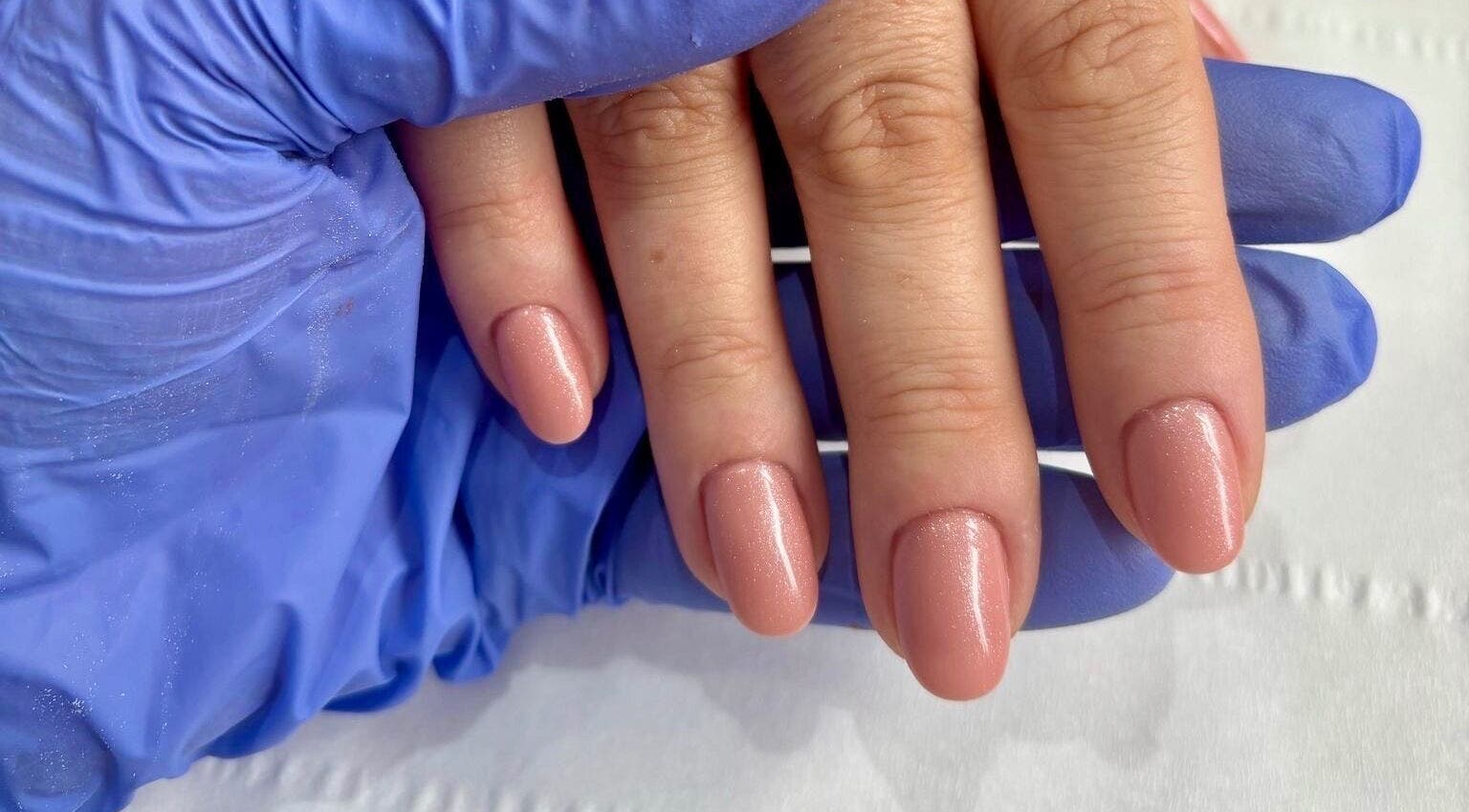 Gorgeous manicured nails at Younger Beauty, Preston, England, GB with a shimmering nude polish.