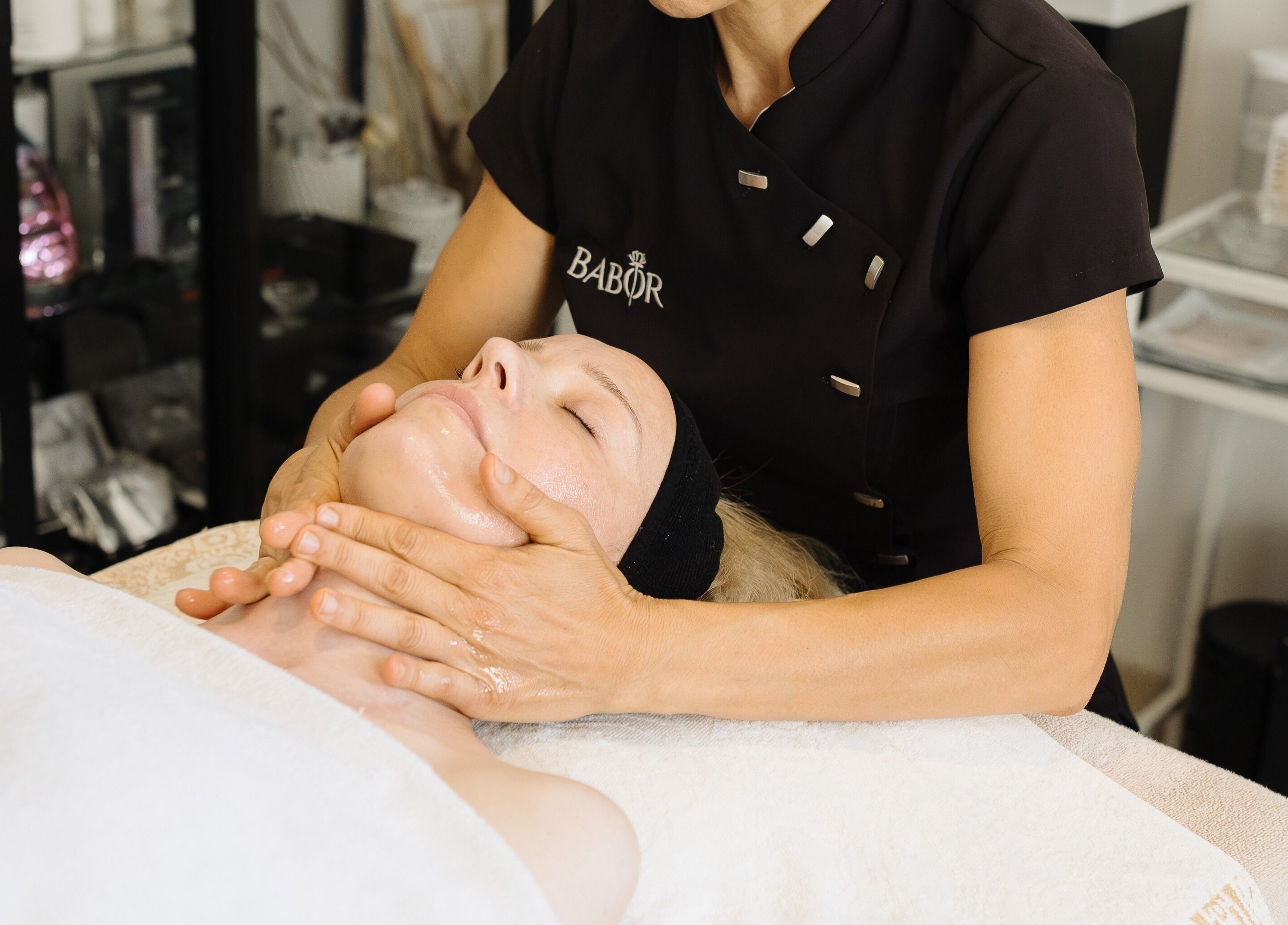 Client receiving a soothing facial massage at Alchemy Spa, Valletta, MT for ultimate relaxation.