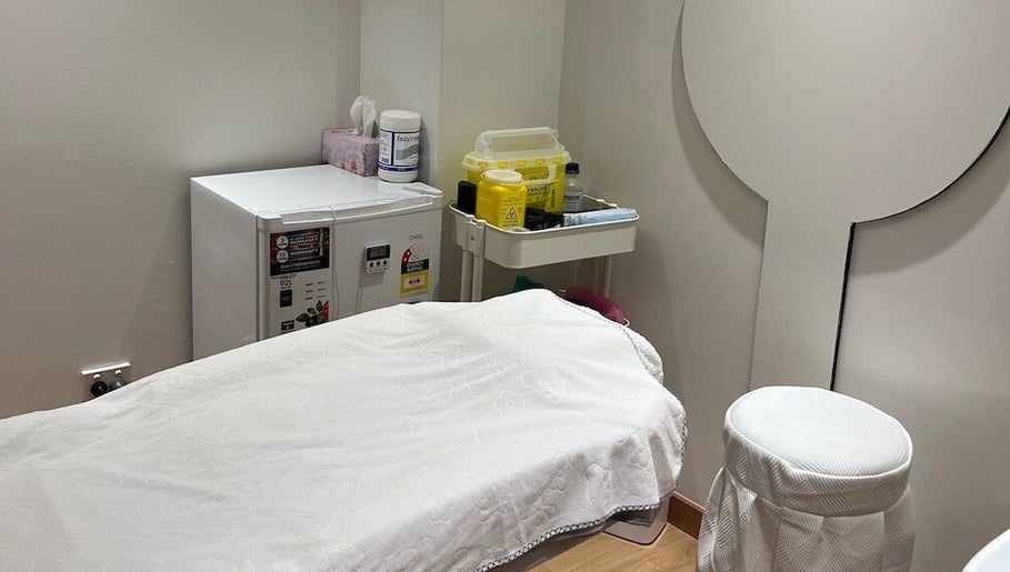 Peaceful treatment room at Chatswood, New South Wales, AU featuring a massage table and calming decor.