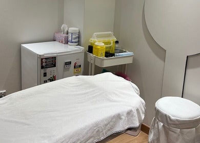 Peaceful treatment room at Chatswood, New South Wales, AU featuring a massage table and calming decor.