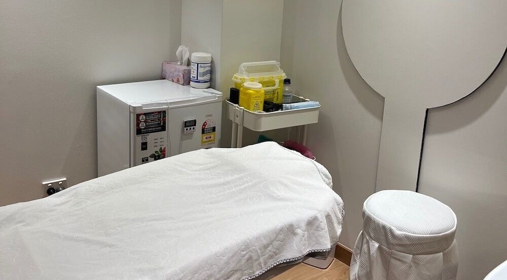 Peaceful treatment room at Chatswood, New South Wales, AU featuring a massage table and calming decor.
