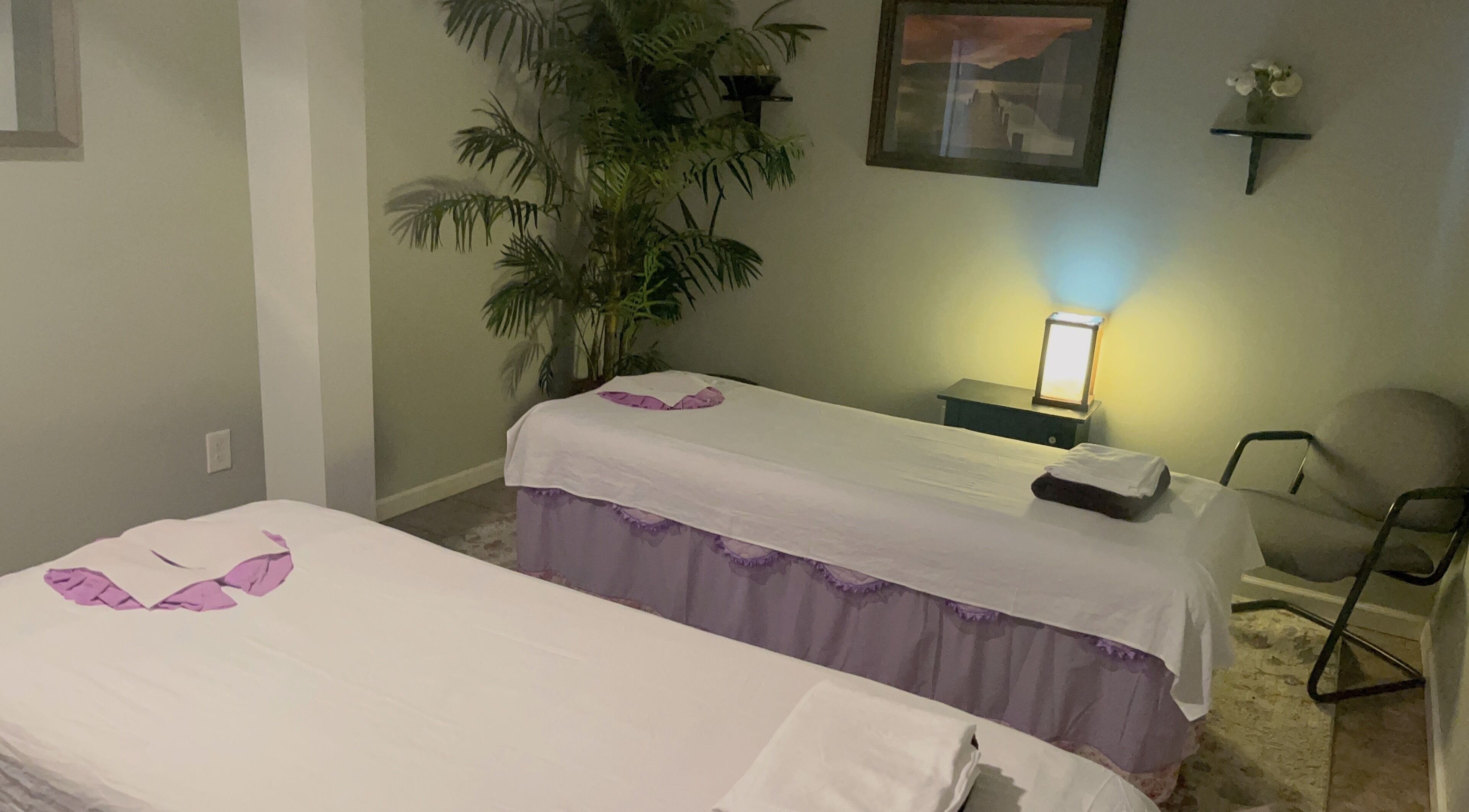 Relaxing massage room with two tables at Bliss Massage Studio, Peabody, Massachusetts, US.