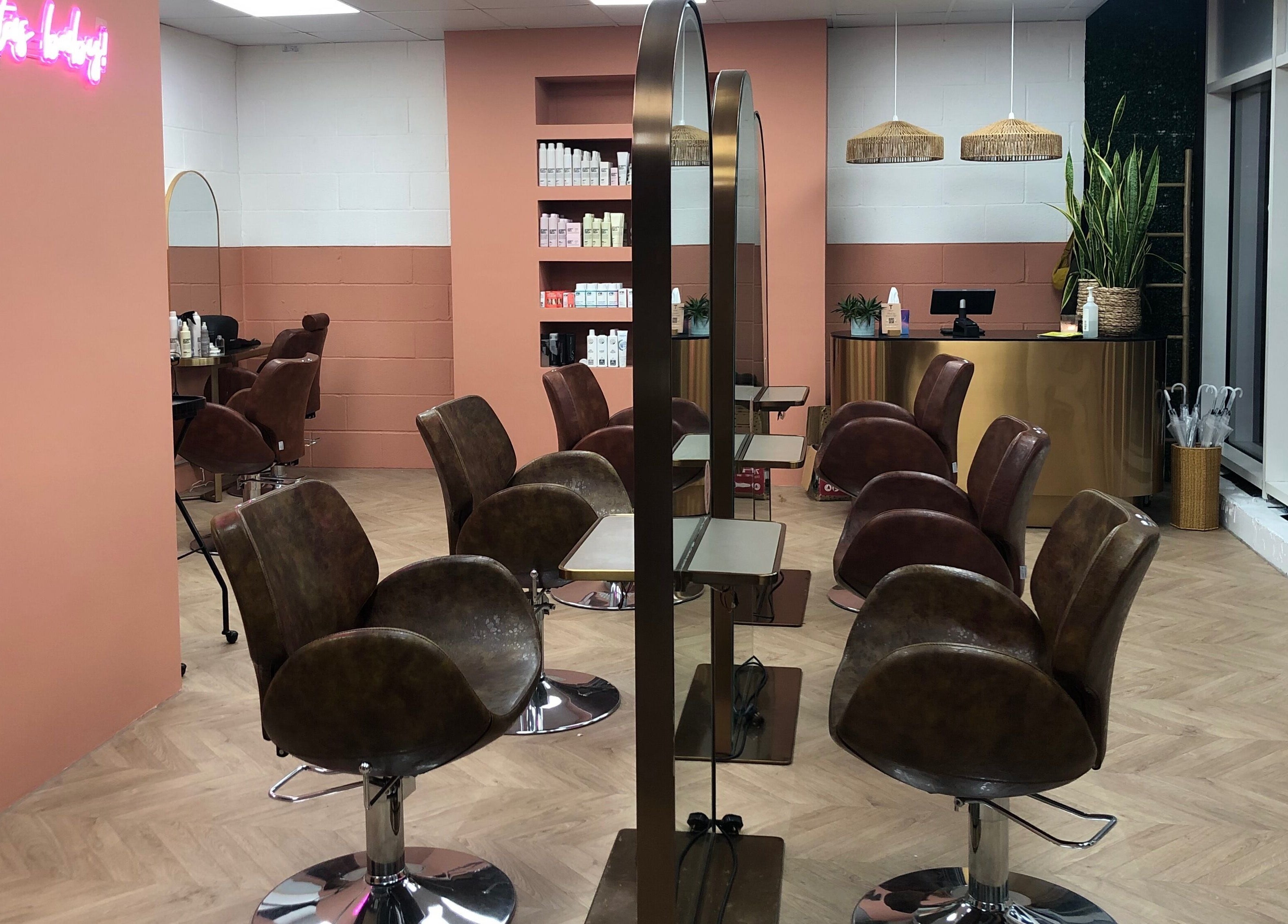 The Tribu Collective's stylish salon interior in London, England, GB with modern chairs and chic decor.