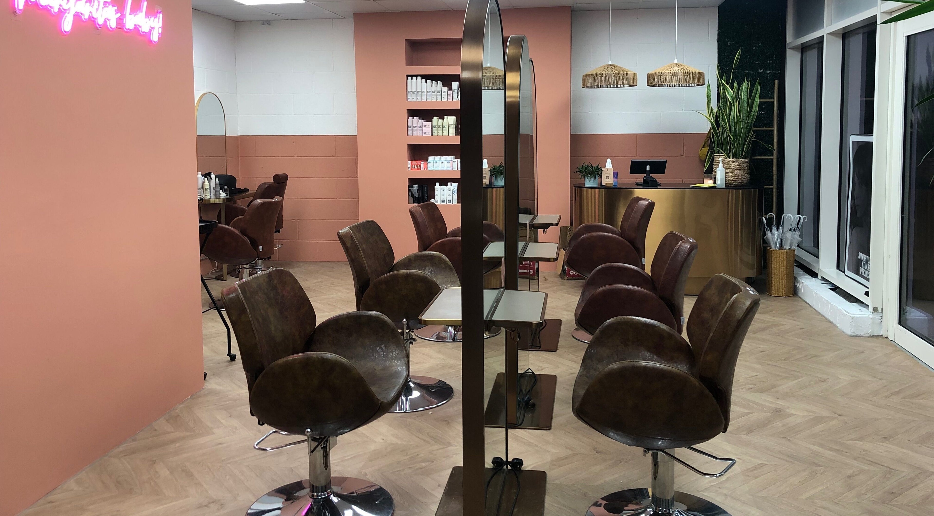 The Tribu Collective's stylish salon interior in London, England, GB with modern chairs and chic decor.