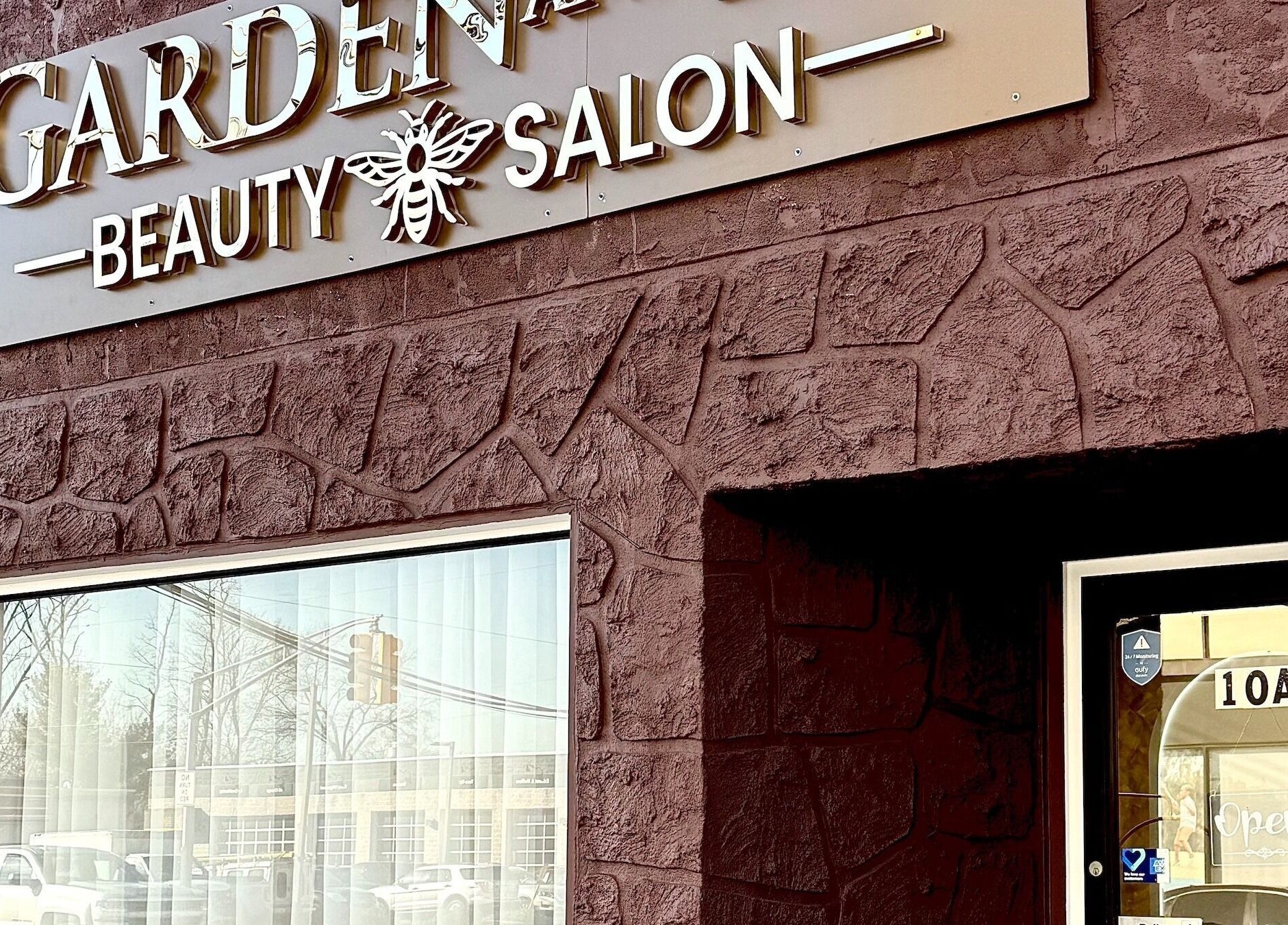 Exterior of Garden and Bee, a beauty salon in Eatontown, New Jersey, US, with unique stone wall design.