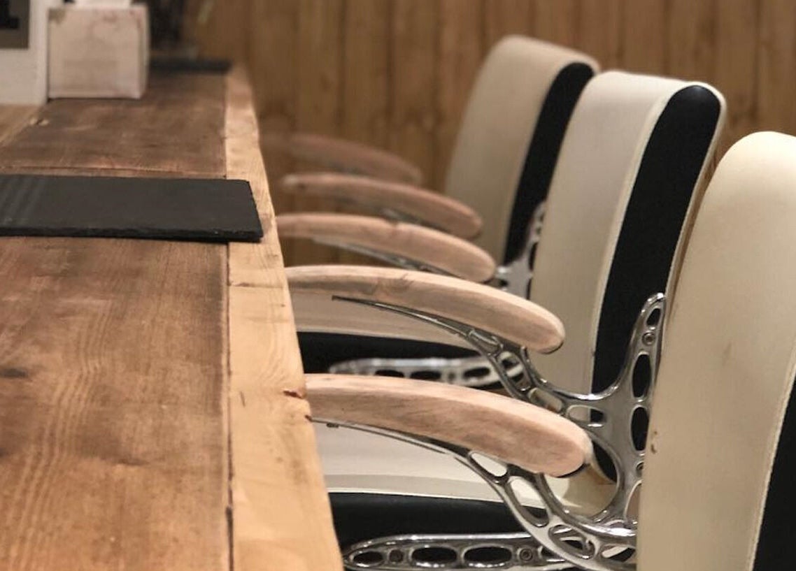 Elegant salon chairs at The Root in Harpenden, England, GB create a luxurious beauty experience.