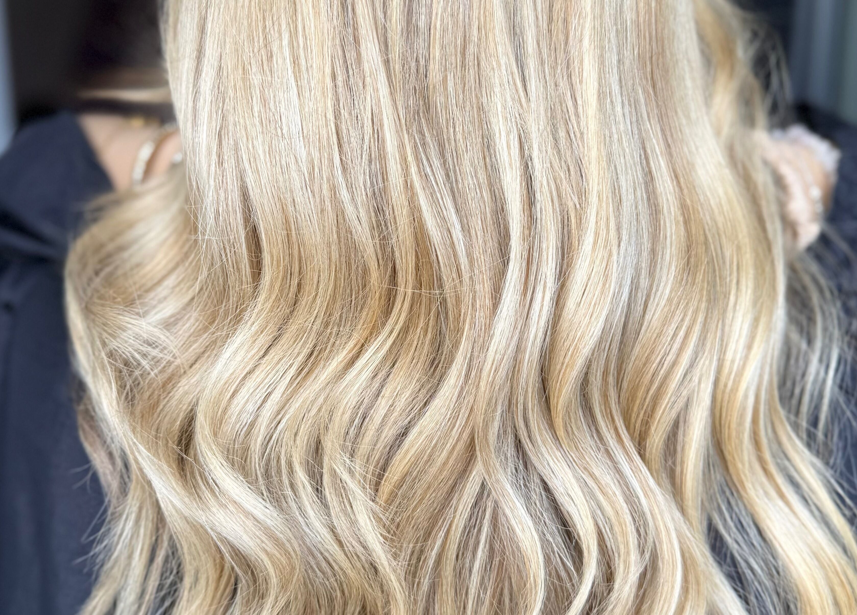 Blonde hair with soft waves styled at Hair by Ciara, Chichester, England, GB.