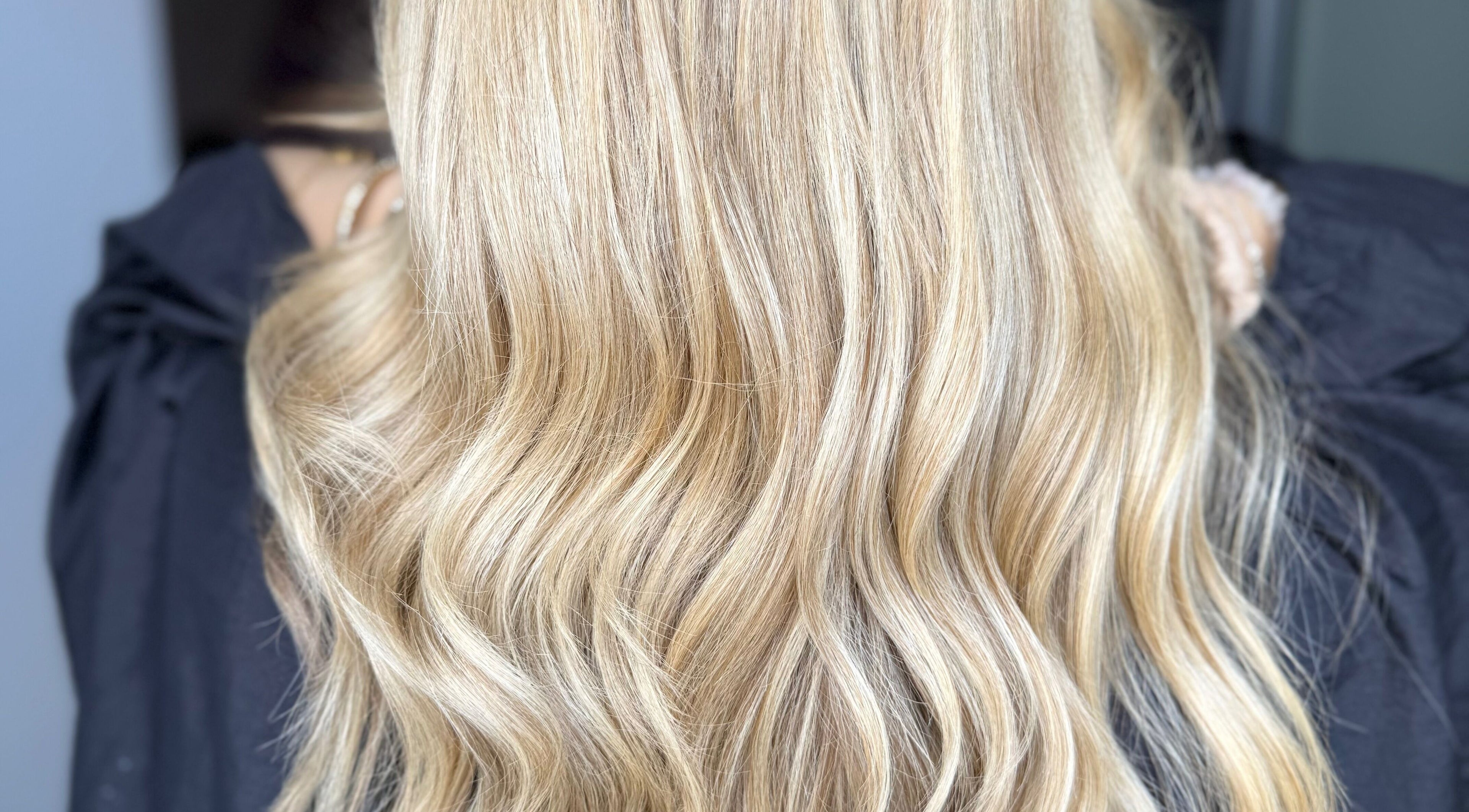 Blonde hair with soft waves styled at Hair by Ciara, Chichester, England, GB.
