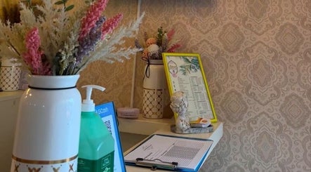Cozy entryway at Lemon Beauty, Parañaque, Metro Manila, PH, featuring floral decor and welcoming ambiance.