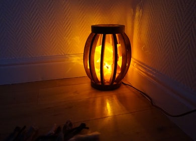 Ambient lamp casting a warm glow in Zen Life Wellness, Linwood, Scotland, GB.