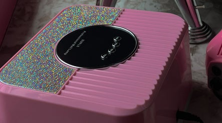 Glimmering pink nail dryer at Bling.ByBubbles in Gqeberha, Eastern Cape, ZA, enhancing salon experience.