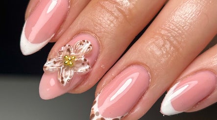 Elegant floral-themed nails at Sylvia Vanessa, Manchester, England, GB showcasing pink and white design.