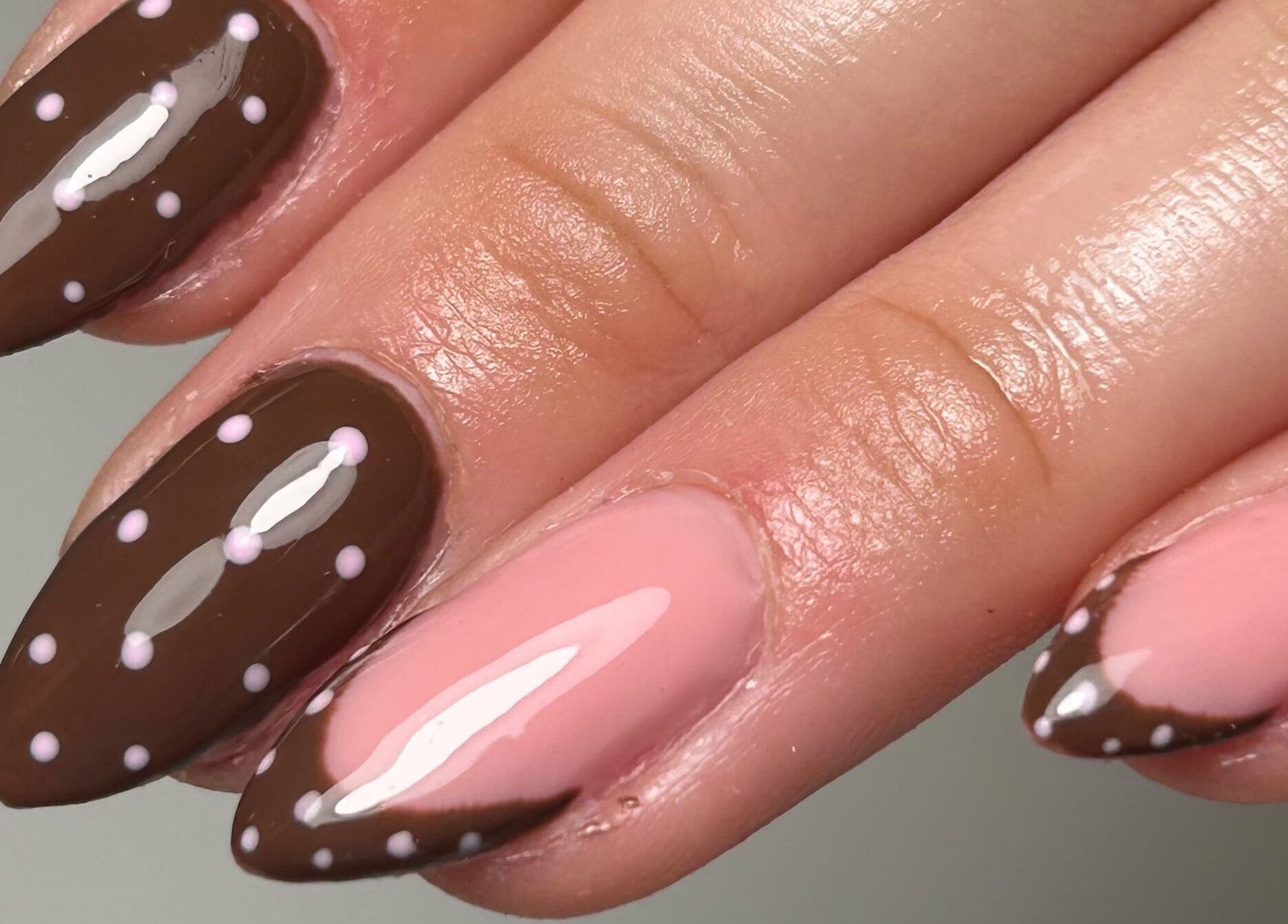 Polka dot nail art in brown and pink at Sylvia Vanessa, Manchester, England, GB.