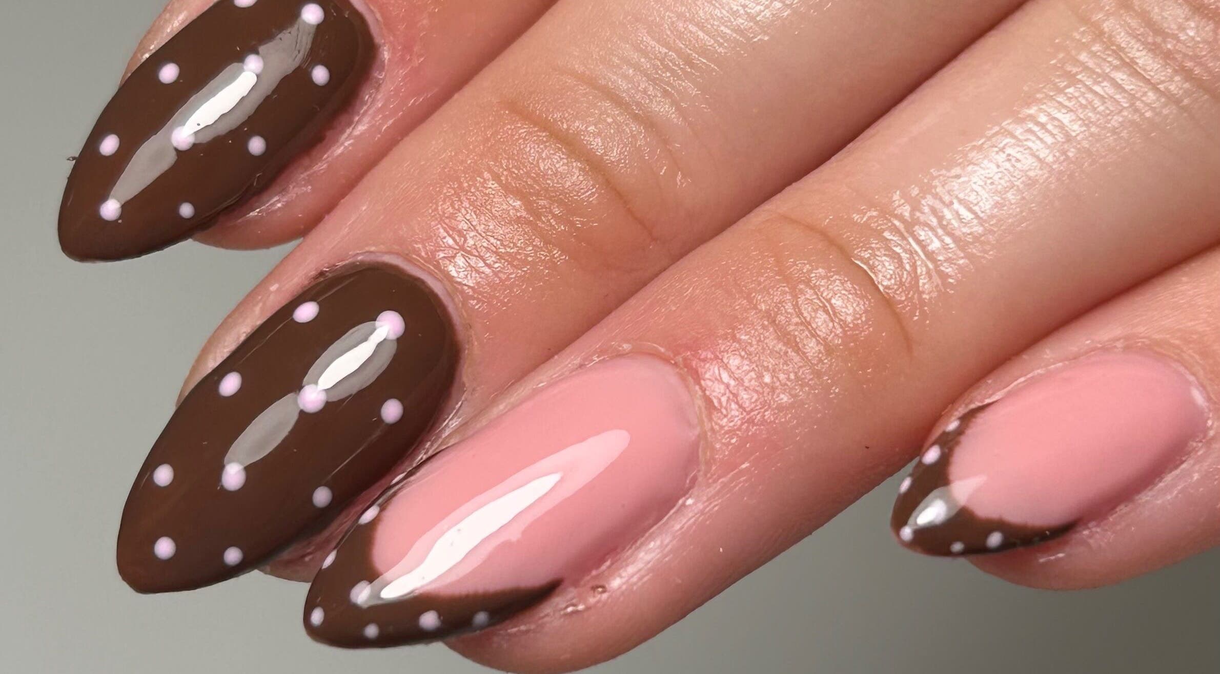 Polka dot nail art in brown and pink at Sylvia Vanessa, Manchester, England, GB.