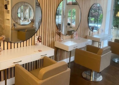 Modern, chic styling area at Stephanie One Hair Spa East Keswick, East Keswick, England, GB with large mirrors.