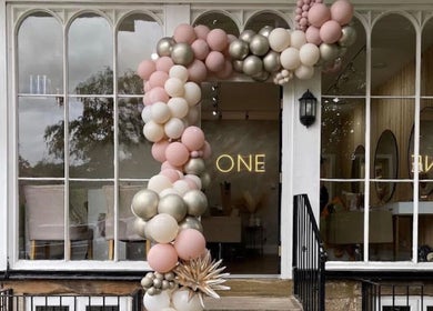 Festive balloon arch adorns the entrance of Stephanie One Hair Spa East Keswick, East Keswick, England, GB.