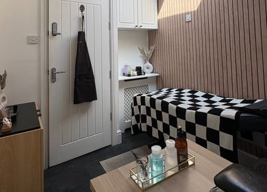 Allurè Beauty treatment room with checkered decor in New Tupton, England, GB. Stylish and calming.
