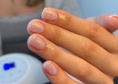 Close-up of glittery nail polish at Allurè Beauty, New Tupton, England, GB, showcasing expert manicure quality.